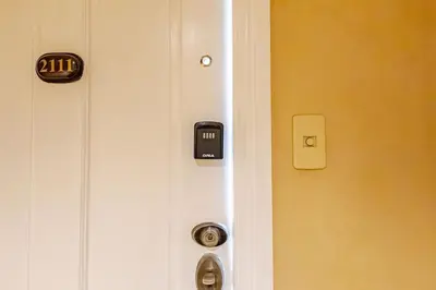 a close up of a door with a sign on it at 55-SQM Stunning View Wood House Poblacion Makati in Manila