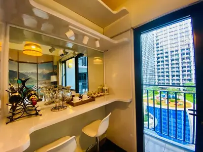 a bathroom with a window with a view of a building at Hotel De Rama Unit 5115 near MOA and NAIA in Manila