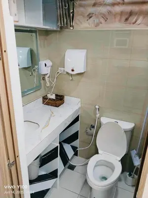 a bathroom with a toilet and a sink at Hotel De Rama Unit 5115 near MOA and NAIA in Manila