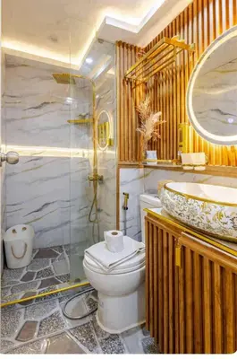 a bathroom with a toilet and a sink at Homesweethome Beach Resort in Manila