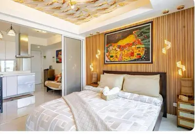 a bedroom with a large bed in a room at Homesweethome Beach Resort in Manila