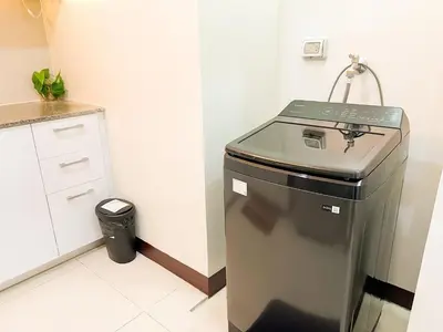 a trash can in a kitchen next to a counter at Stylish 1BR Prime BGC Uptown near Hyatt #upt119c in Manila