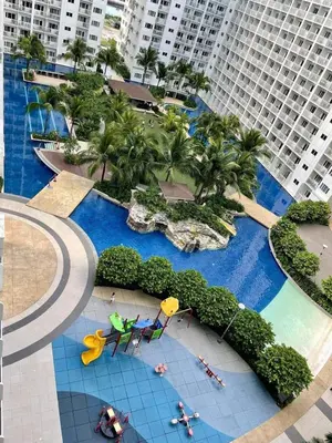 an aerial view of a swimming pool in a resort at Hotel De Rama Unit 1230 near MOA & NAIA in Manila