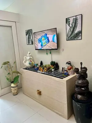 a flat screen tv sitting on top of a room at V&G Era Staycation in Manila