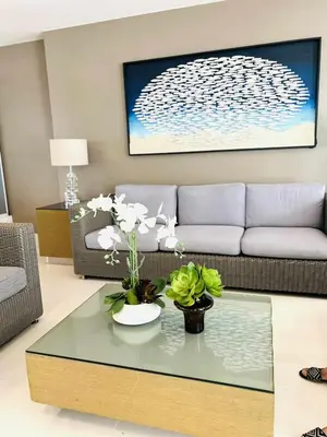 a living room with a couch and a coffee table at V&G Era Staycation in Manila