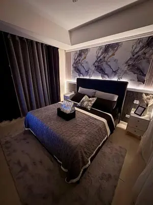 a bedroom with a large bed in a room at Dream Escapade in Manila