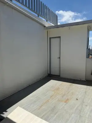a white garage with a door on a building at 4 stores with rooftop in Manila