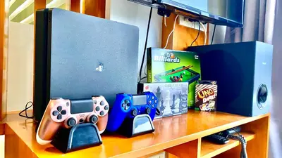 a table topped with nintendo wii game controllers and boxes at Stunning view staycation near MOA PICC WORLD TRADE CENTER AIRPORT LUNETA PARK MANILA OCEAN PARK QURINO GRANDSTAND in Manila