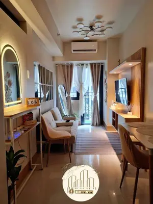 a living room with a couch and a table at EcityStay in Manila