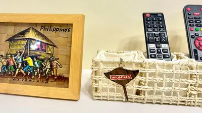 a picture of a house and a remote control at Cozy accommodation near MOA AIRPORT WORLD TRADE AND PICC in Manila