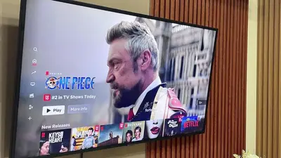 a television screen with a picture of a man on it at Cozy accommodation near MOA AIRPORT WORLD TRADE AND PICC in Manila