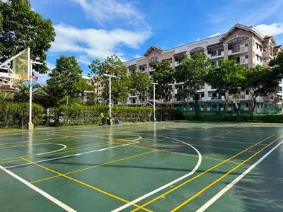 a basketball court in front of a building at Boutique one-bedroom apartment near airport, business hubs in Manila