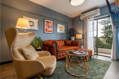 a living room with a couch and a chair at Boutique one-bedroom apartment near airport, business hubs in Manila