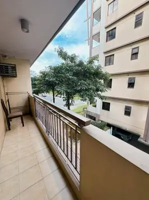 a balcony with a view of a building at Apartment in Parañaque in Manila