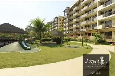 a playground in front of a apartment building at Apartment in Parañaque in Manila