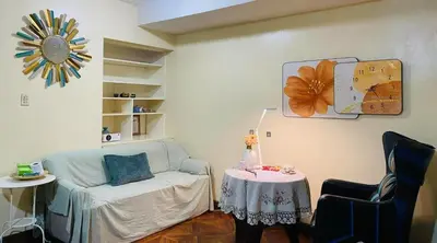 a living room with a couch and a table at Stan Condo in Manila
