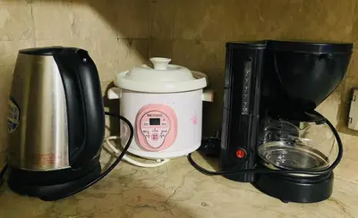 a coffee maker and a blender on a counter at Stan Condo in Manila