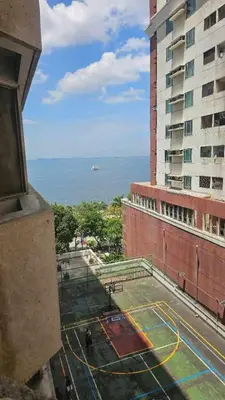 a view of a tennis court on the side of a building at Stan Condo in Manila