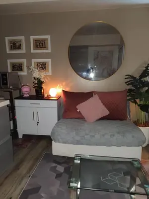 a room with a bed with a mirror and a table at Azure Urban Resort Residences in Manila