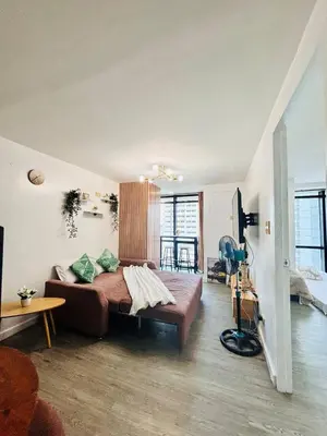 a bedroom with a large bed in a room at Cozy and comfy place at Ortigas Pasig City in Manila