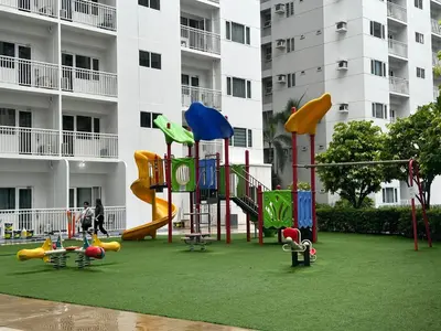 a playground in front of a apartment building at marbys pad shore residences in Manila