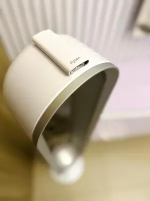 a close up of a wii remote in a holder at staycation condo one bedroom balcony w pool view near SMX SM MOA IKEA NAIA DFA OCEAN PARK in Manila