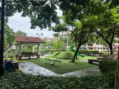 a park with a bench and a playground at Functional stay near airport, business districts in Manila