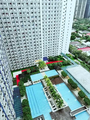 an aerial view of a large building with swimming pools at Fourth's Jazz Cozy Pad in Manila