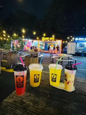 a group of four drinks sitting on a wooden table at KD's Home - Fast WiFi, Netflix , Pool , Karaoke in Manila