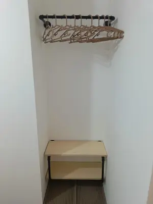 a table and a shelf in a room at Gale Haven in Manila