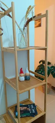 a wooden shelf with some items on it at Gale Haven in Manila