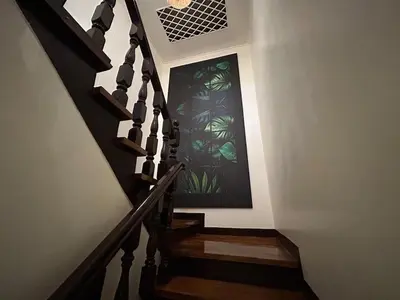 a staircase with a stained glass window in a house at 4Br House in Pasay near airport in Manila