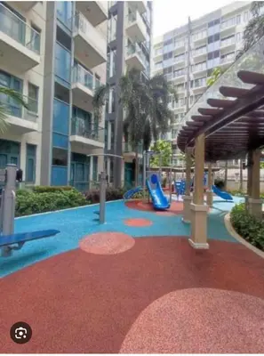 a playground with a slide in a building at MCV Condotel Near Terminal 3 in Manila