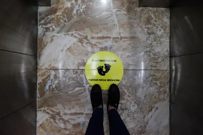 a person standing on a floor with a tennis ball at Oriental Zen Suites in Manila