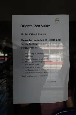 a white piece of paper with the words unethical zen suites at Oriental Zen Suites in Manila