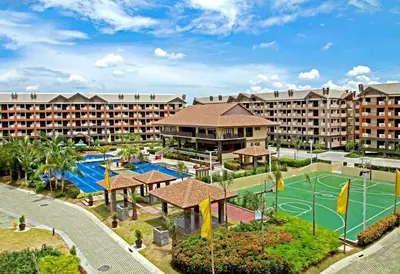 an aerial view of a resort with a tennis court at Tropical Hawaiian 2BR Condo Unit in Metro Manila with Laundry Area - Sleeps 4 in Manila