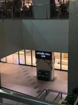 a view of an empty mall with a pair of glasses at One Uptown Residence BGC 1BR sofabed in Manila
