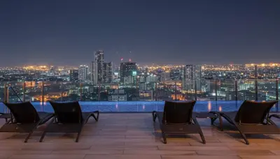 a group of chairs sitting on top of a roof at Private Apartment walk to Greenbelt, Legazpi Village in Manila
