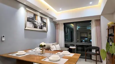 a dining room with a table and chairs at Private Apartment walk to Greenbelt, Legazpi Village in Manila