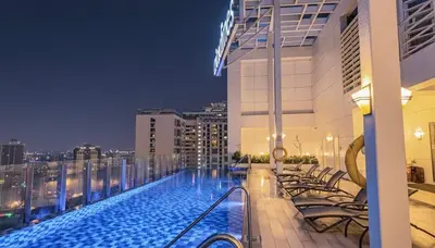 a swimming pool on the roof of a building at Private Apartment walk to Greenbelt, Legazpi Village in Manila