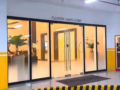 a display case with glass doors in a building at Modern 1BR with Magnificant Garden View, Near Airports, Okada, Solaire with Free Parking in Manila