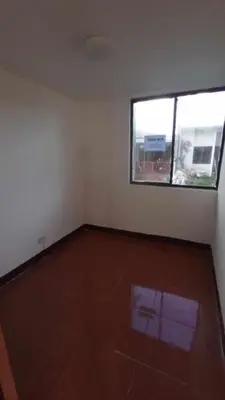an empty room with a large window and a wooden floor at Amaia Escapes Calamba in Calamba
