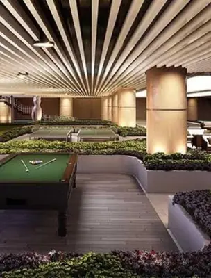 a room with a pool table and a pool table at Makati Penthouse Studio with City Views in Manila