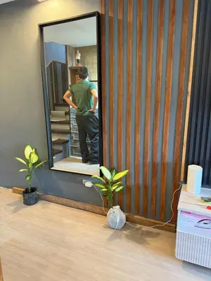 a man standing in front of a mirror at 2 bedroom loft type with 2 baths Near Rockwell in Manila