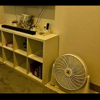 a white fan sitting in the corner of a room at Place To Stay Near US Embassy Front Of Manila Bay in Manila