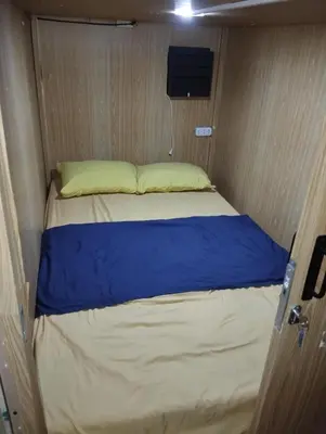 a bed in a small room in a caravan at Capsule bed in Manila