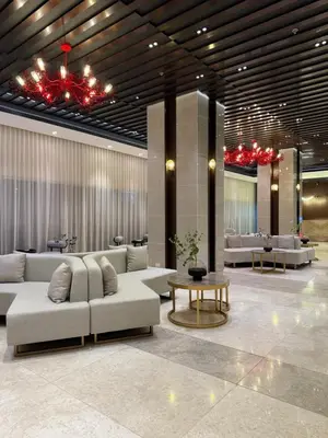 a living room with couches and a table in a building at Infinity Suites Makati in Manila