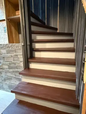 a set of stairs in a house at 2 bedroom loft type near Rockwell in Manila