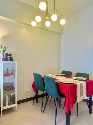 a dining room with a table and chairs at Casa de Caysido in Manila