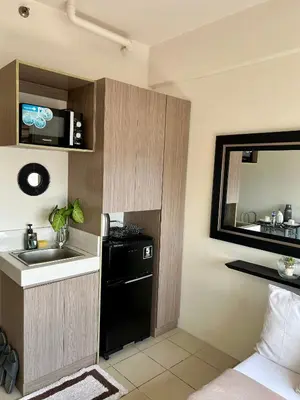 a small kitchen with a sink and a black dishwasher at NIJECRIFIL Condotel in Manila